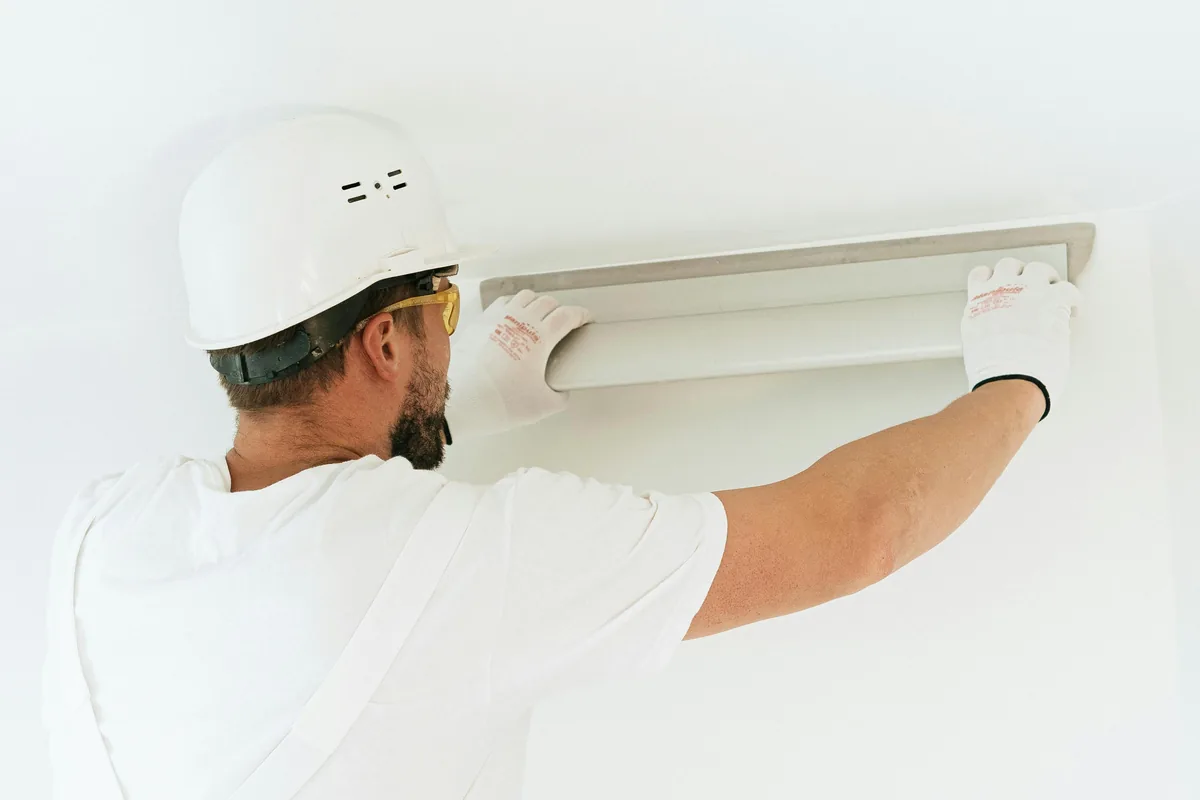 Installer running a leak check on a newly set toilet in a Florida bathroom