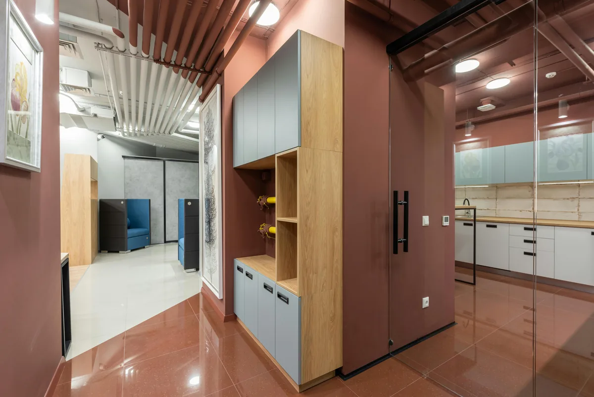 Cutaway of a custom cabinet showing a marine-grade plywood box, sealed sink-base floor, and soft-close drawer slide