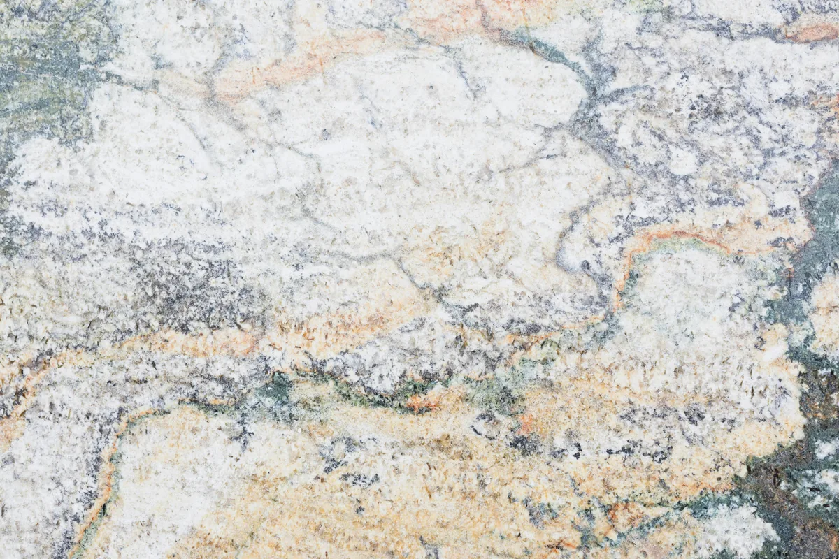 Concrete floor mid-process showing the grit progression from ground to a high-gloss polished finish