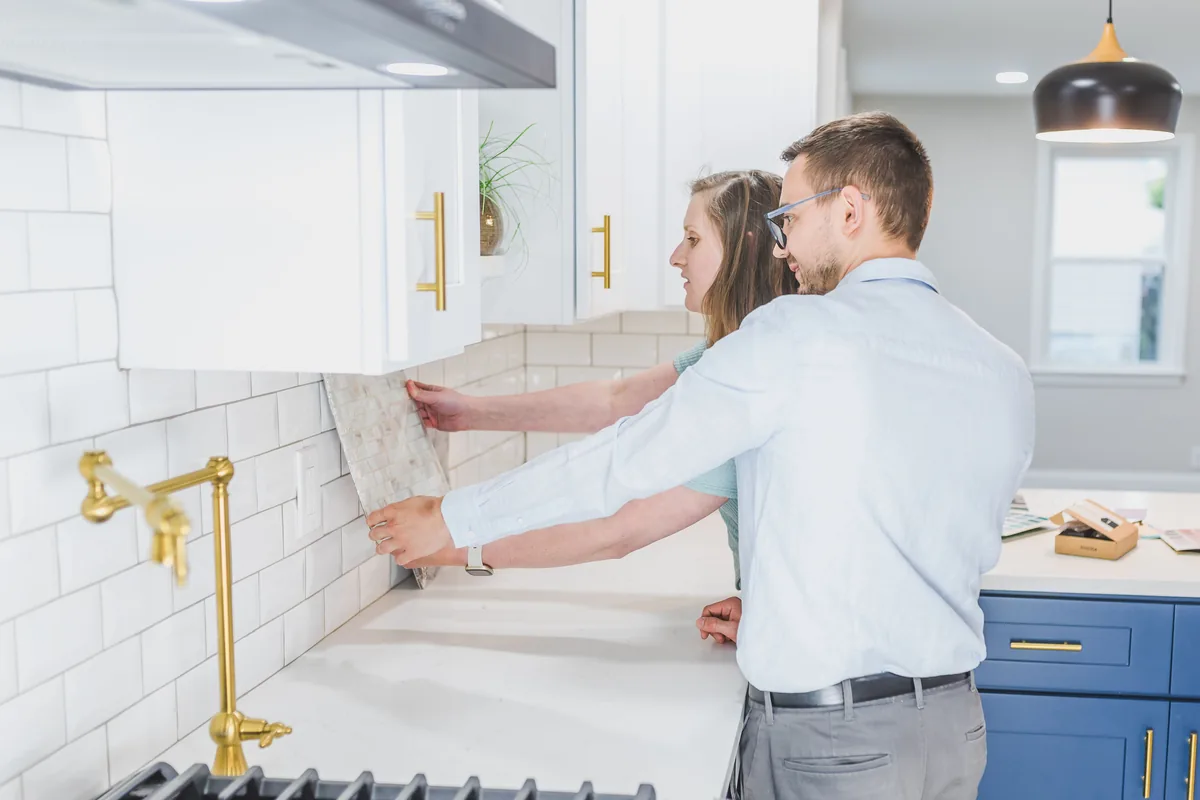 Sealing the grout on a newly tiled Florida kitchen backsplash to resist humidity and mildew