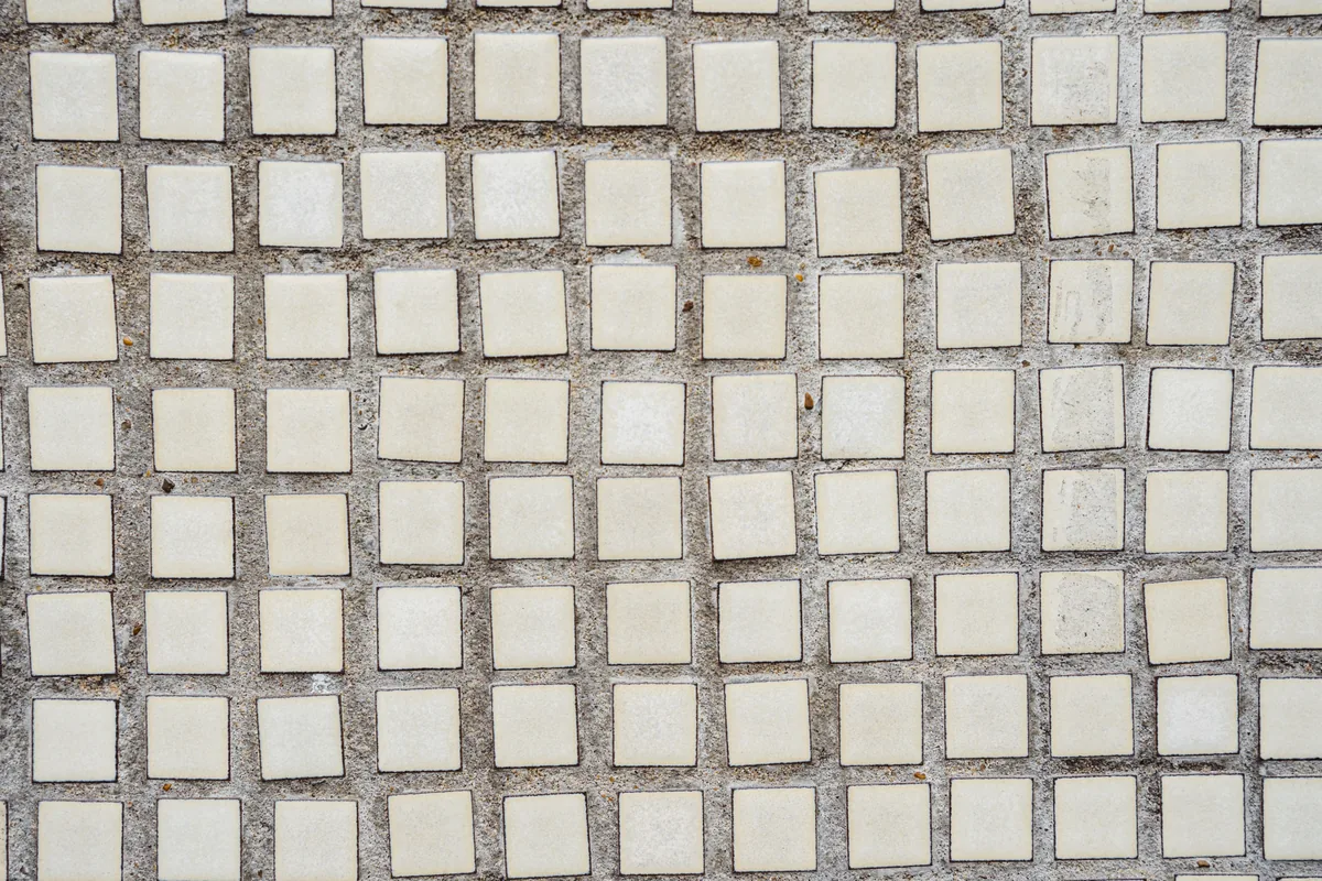 Glazed ceramic subway tile set on a Florida bathroom wall with sealed grout joints