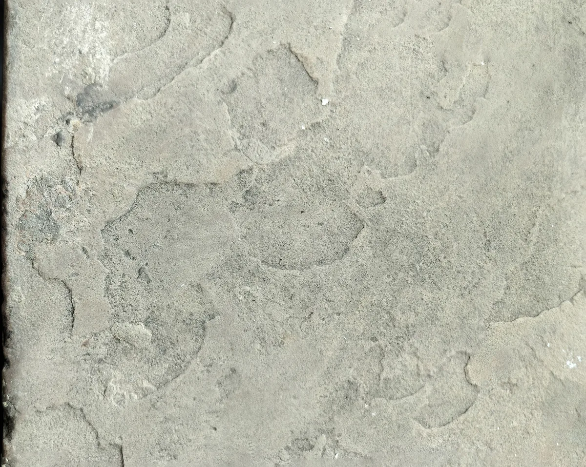 Installer sounding a Florida tile floor to map hollow tiles before repair